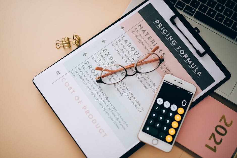 A close-up image displays a smartphone with a calculator app open on its screen, placed on top of a printed pricing quote document titled 'Pricing Formula' with incomplete text visible. Resting on the
